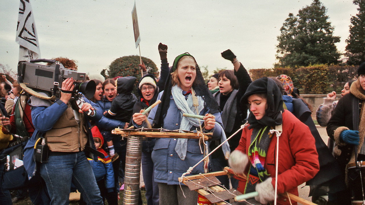 With Love and Rage backdrop