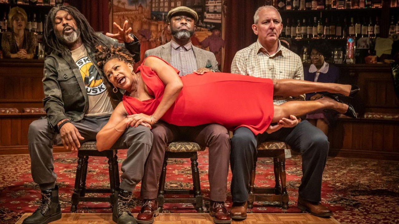 National Theatre Live: The Wife of Willesden backdrop