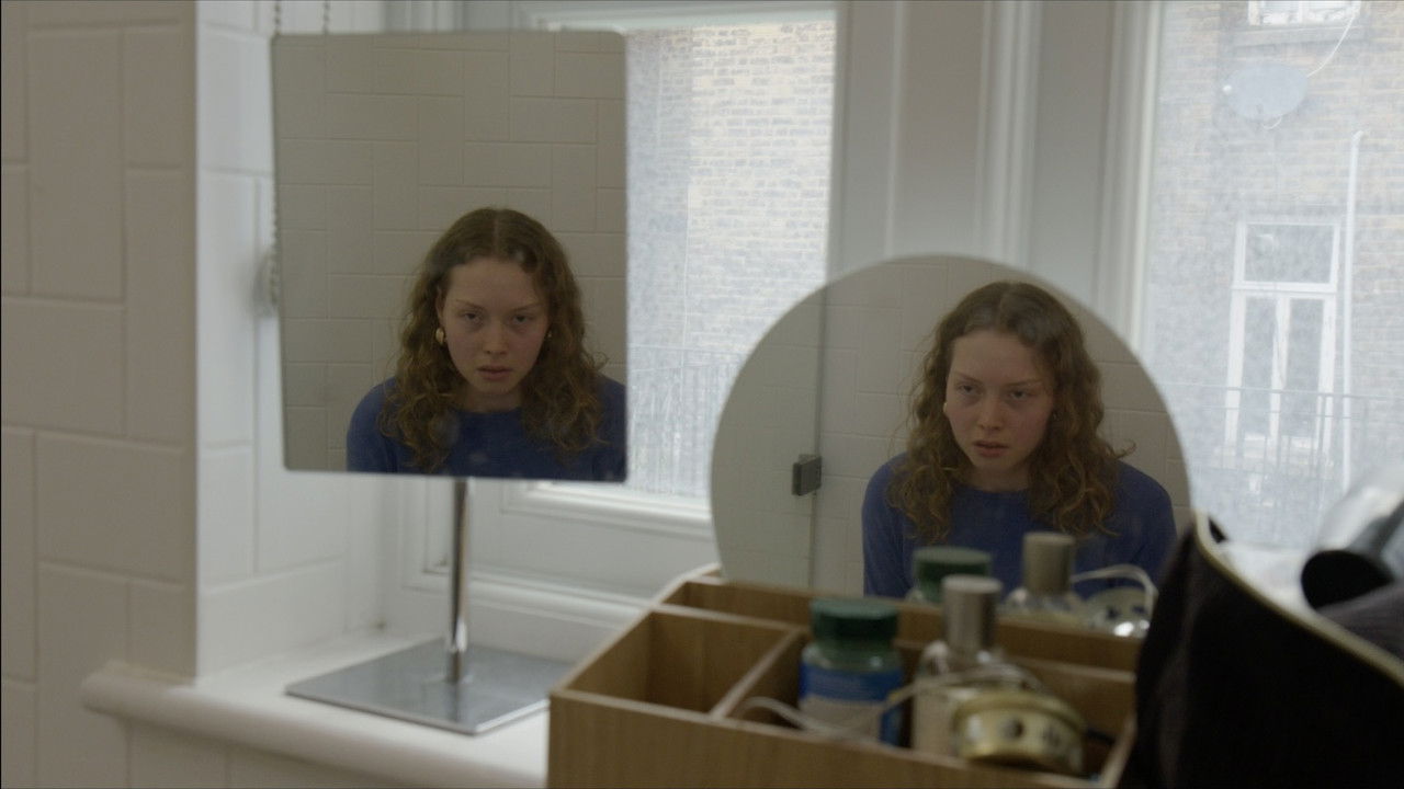 Behind the Lens backdrop