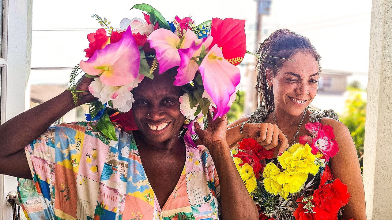 The Caribbean with Andi and Miquita backdrop