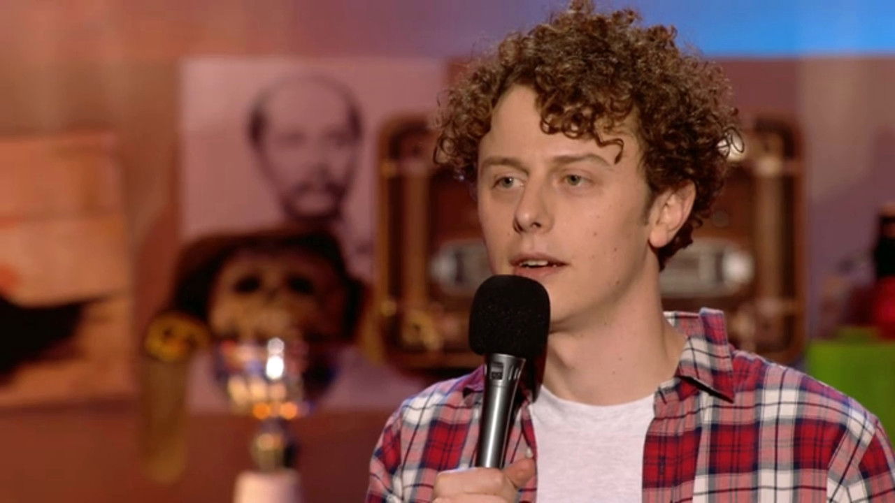 Norman on stage backdrop