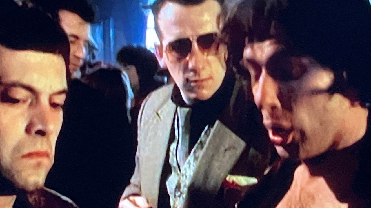 The Bullshitters: Roll Out the Gunbarrel backdrop