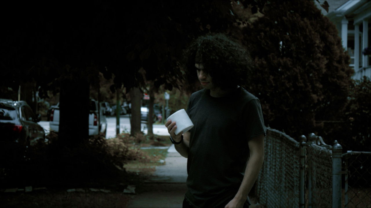 The T.P. Curse backdrop