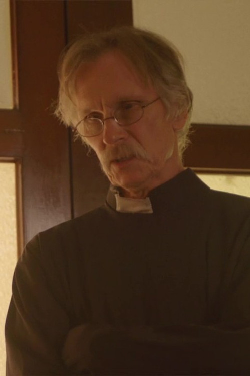 Daniel Steere as Father Stewart