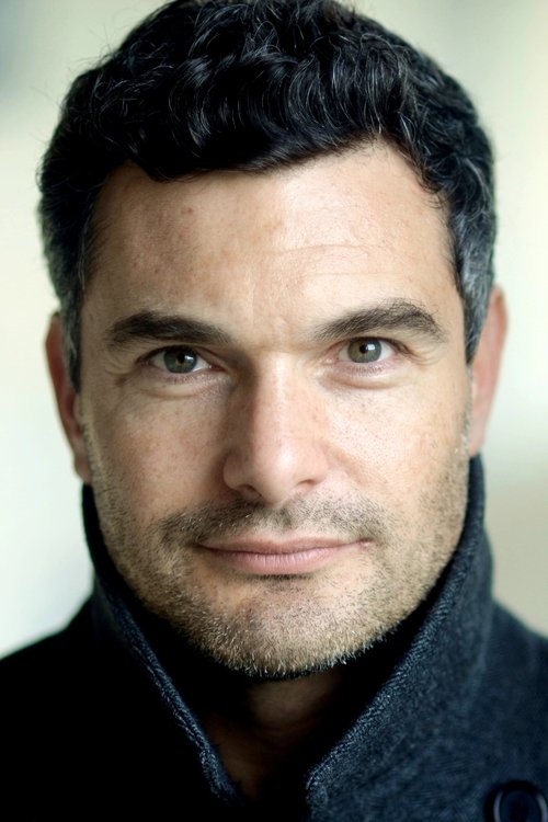 Russell Bentley as Voice of George Reisner