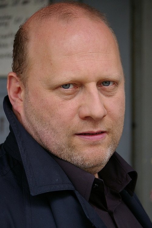Matthias van den Berg as Car Dealer