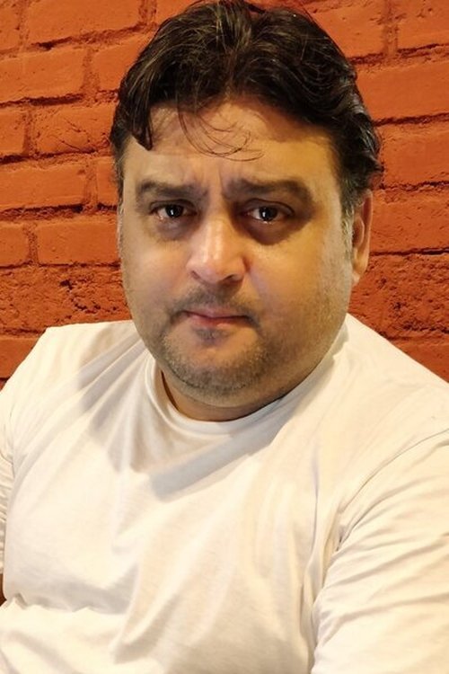 Ashwin Kaushal as Dharmesh Jain