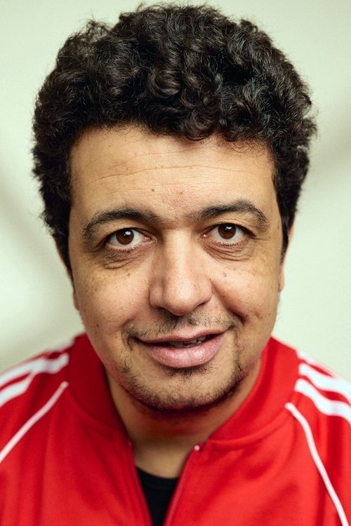 Mustapha Abourachid as Arnaque
