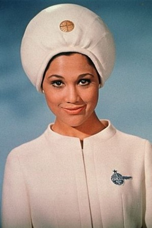 Edwina Carroll as Aries-1B Stewardess