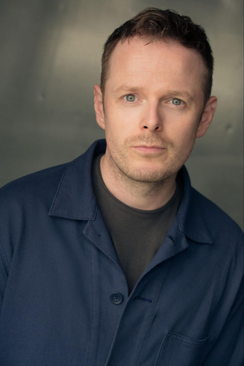 Simon Darwen as Male TV Announcer