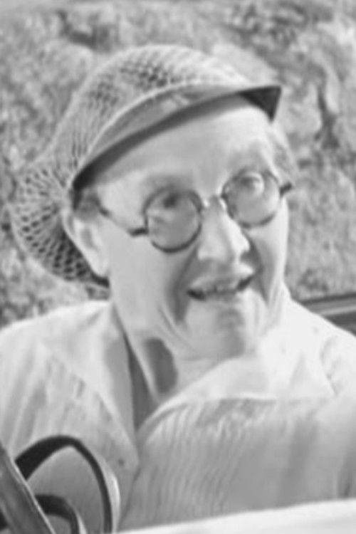 Valentine Camax as Charwoman