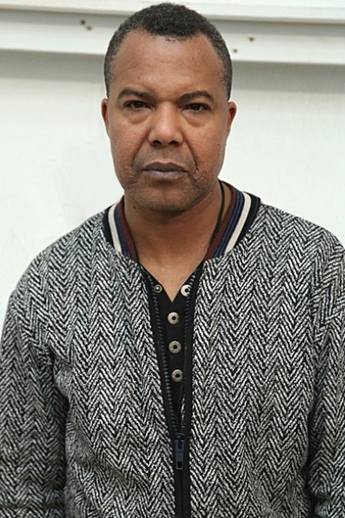 Lamine Kouyaté as the Timber Merchant