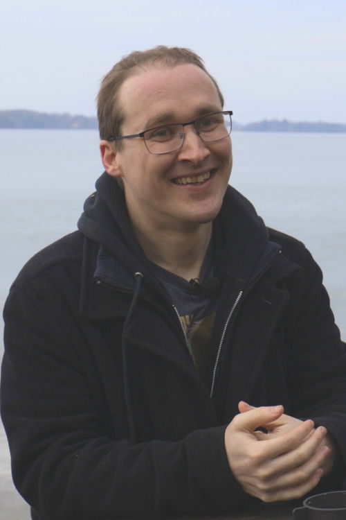 Alex Davidson as Photographotter