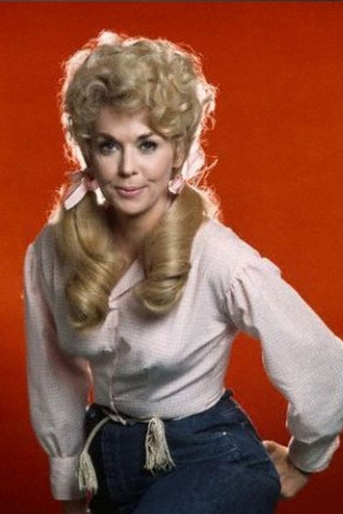 Donna Douglas as Elly May Clampett