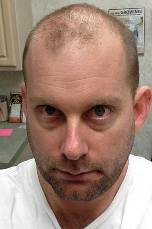 Alan Abdine as The Cop