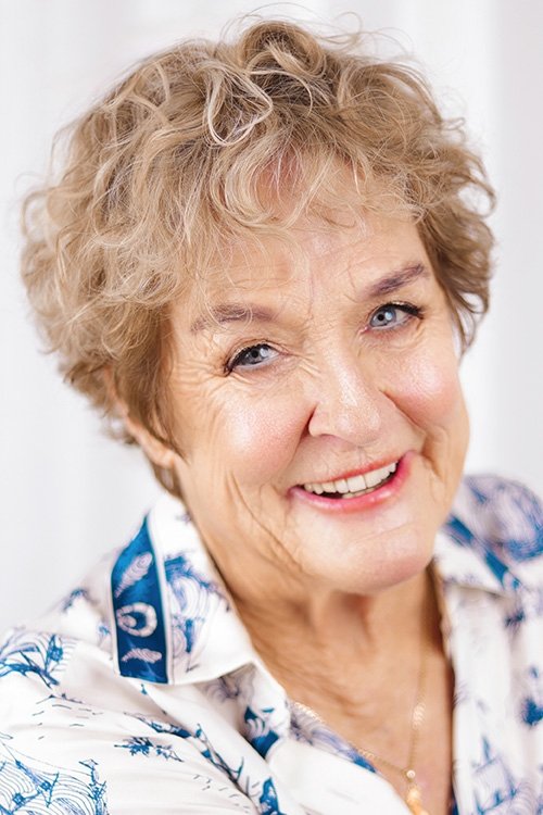 Judy Nunn as Mrs. Lewis