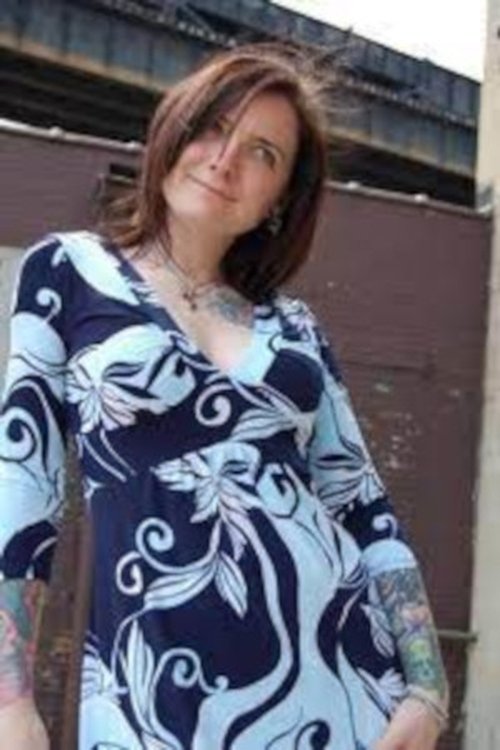 Emily Haack as Ashley Lomack