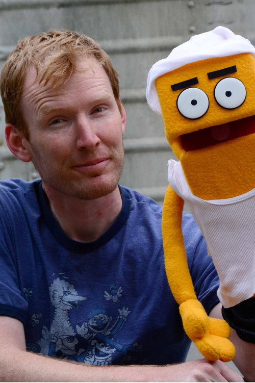 Randall McNair as Robert Service