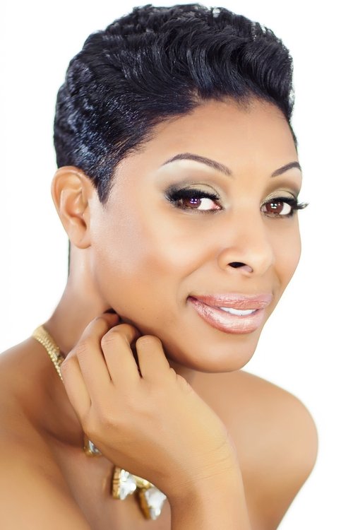 Varda Étienne as TV Presenter #2