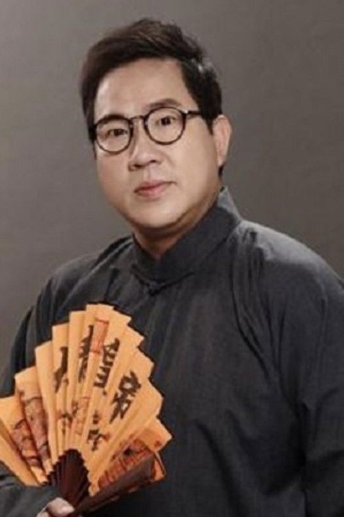 Er-Jin Liu as Hotel Lobby Manager