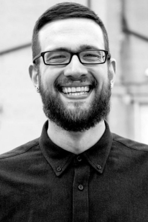 Jay Drakulic as Host of Unresolved Mysteries