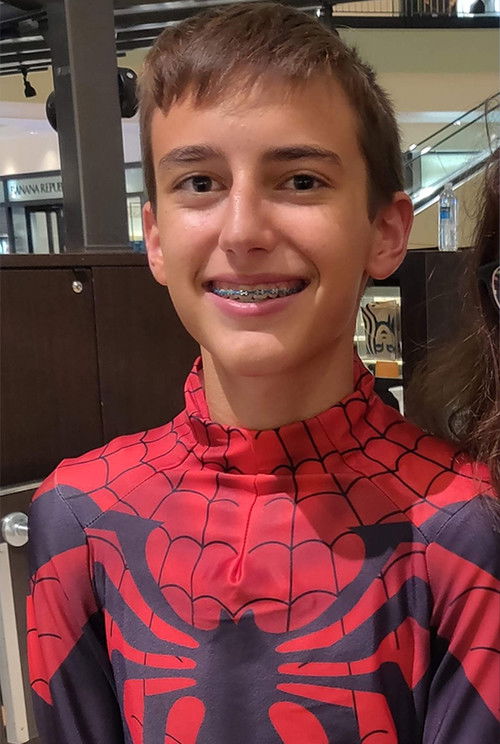 Joseph Long as The Man in the Suit