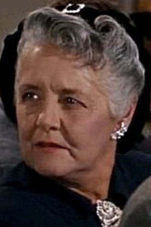 Helen Spring as Woman at Baggage Counter