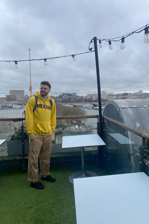 Caleb Thompson as Man on street