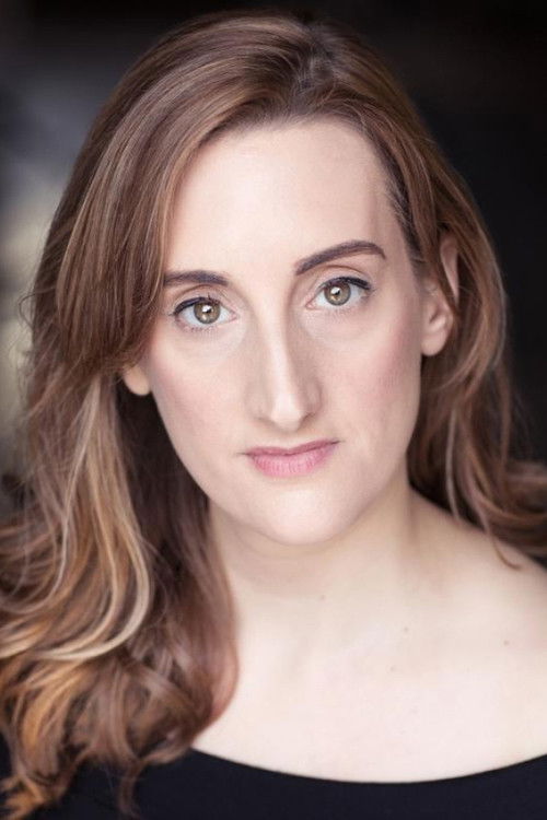 Lucy Avison as Newsreader #1