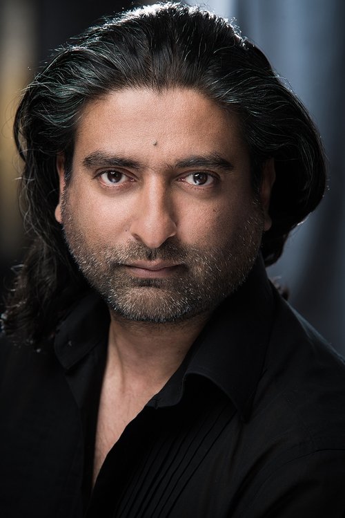 Andrew Rajan as Person on Train