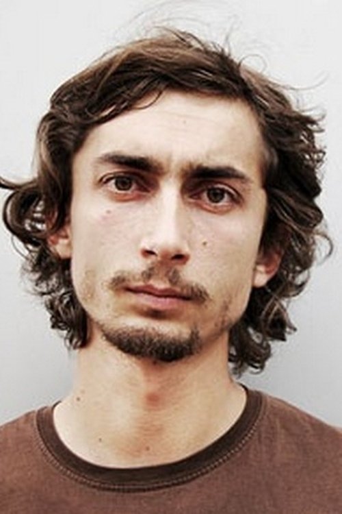 Marcin Pempuś as Bogdan, employee of the community center