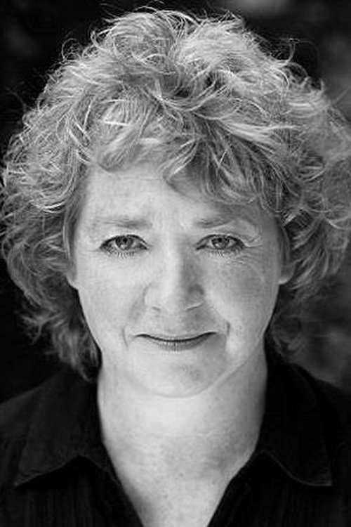 Pauline Whitaker as Woman in Tweed