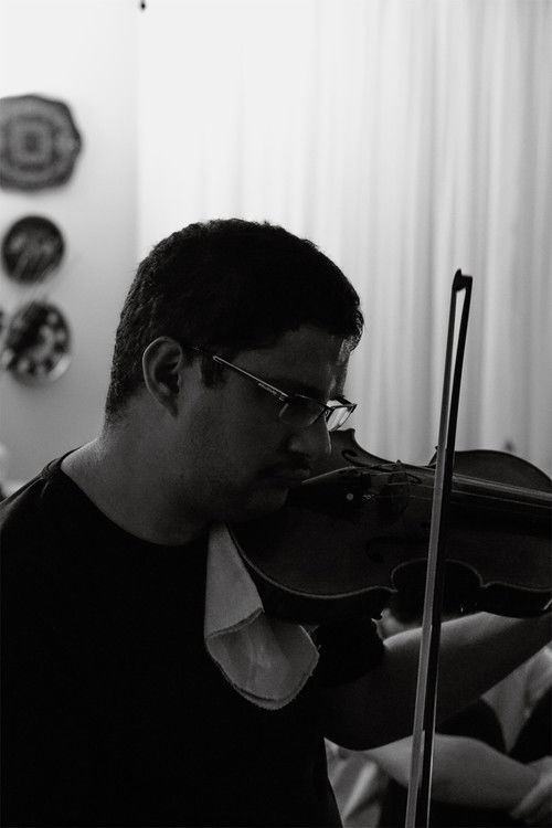 Andrey Grego as Violin