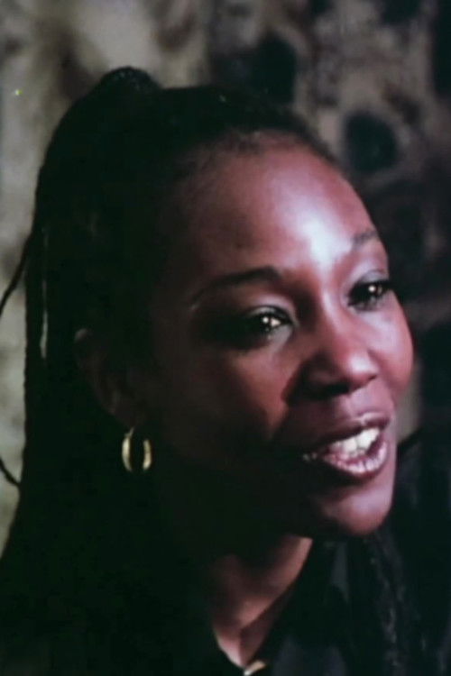 Lidie Ferdics as Gina, the Black Maid