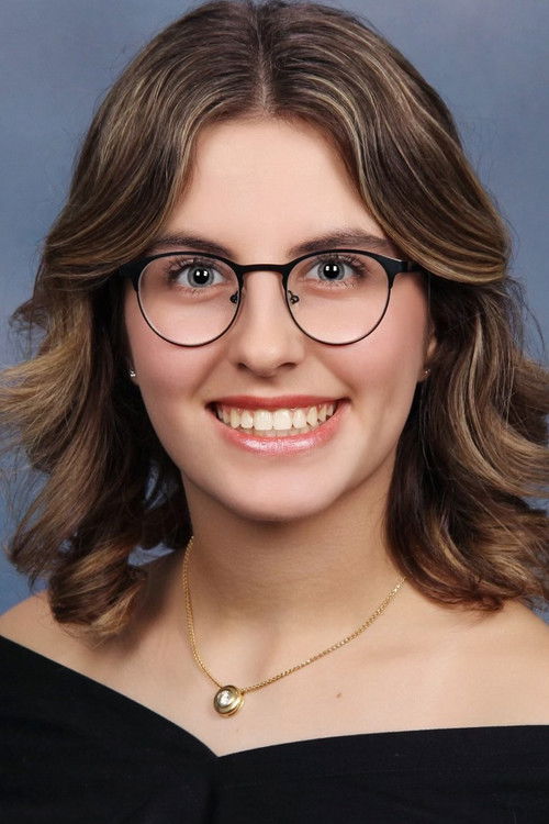 Kamly Shaheen as Newscaster