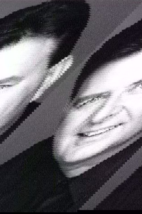 Denis Corbett as Bakery Patron #2 (uncredited)