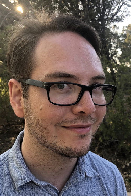 Ben Sanderson as The Voice