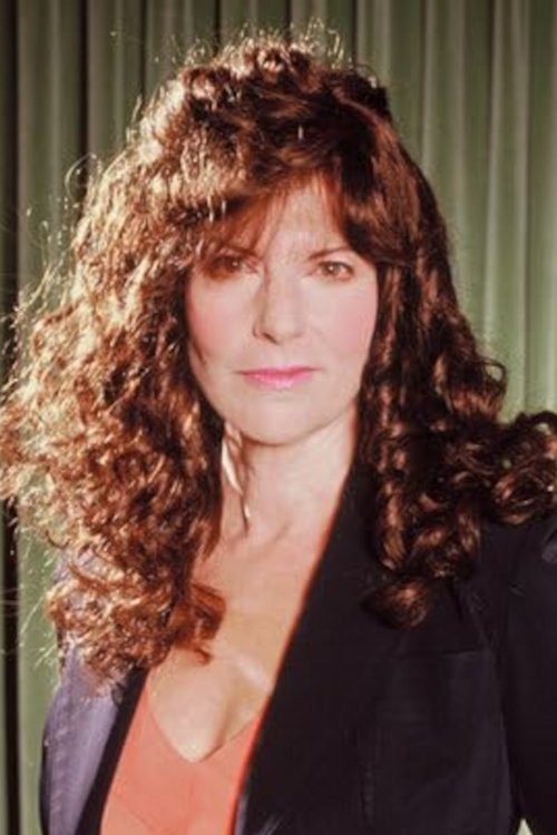 Elaine Corral Kendall as TV Anchor