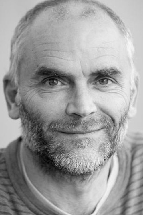 Giles King as Frank, the tattoo man