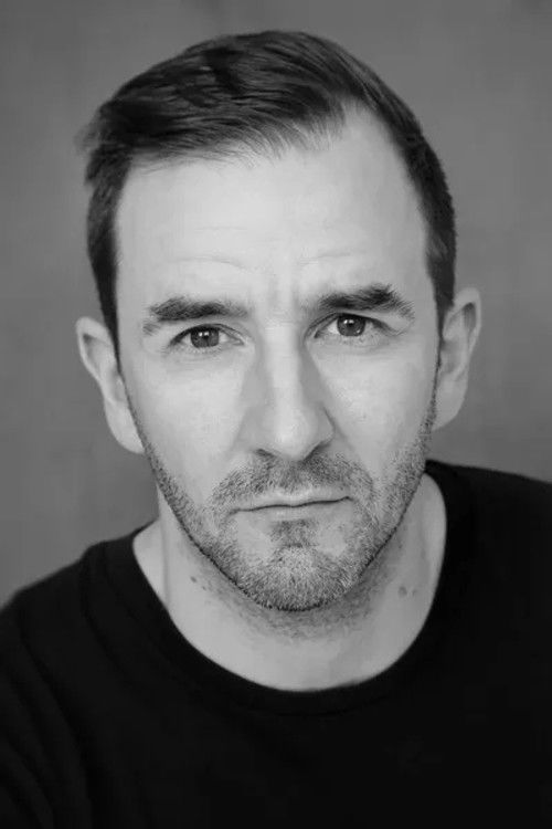 Tom Harwood as Security Guard