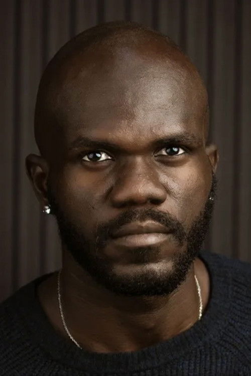 Tobi Marho as Colonel Basiru's ADC