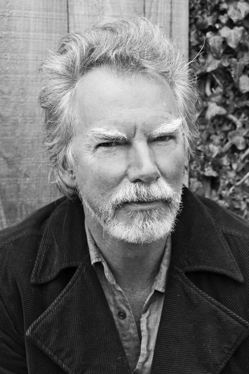 Colin Bass as Bass, acoustic guitar, vocals