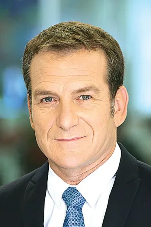 Danny Kushmaro as News Anchor