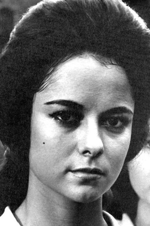 Maggie de la Riva as 