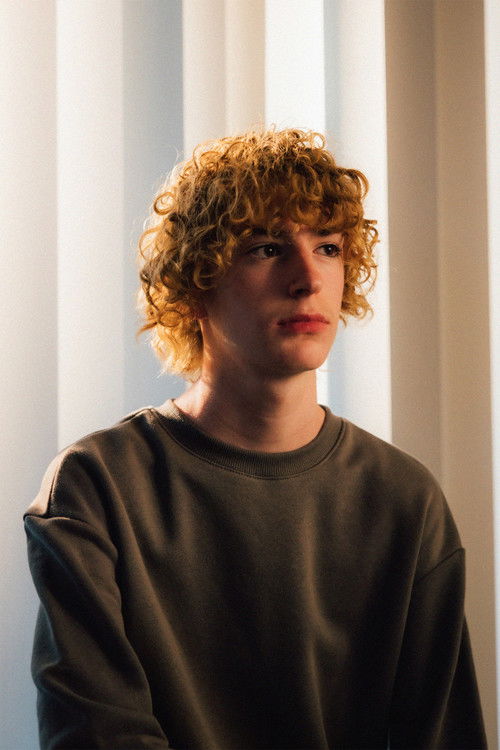 Zachary Colmenero as John Williams