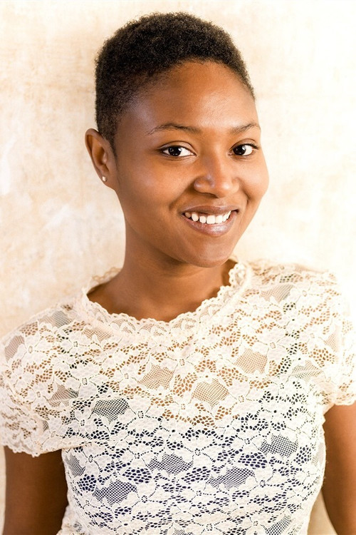 Assouma Sow as Vendeuse 2 (Christiane)