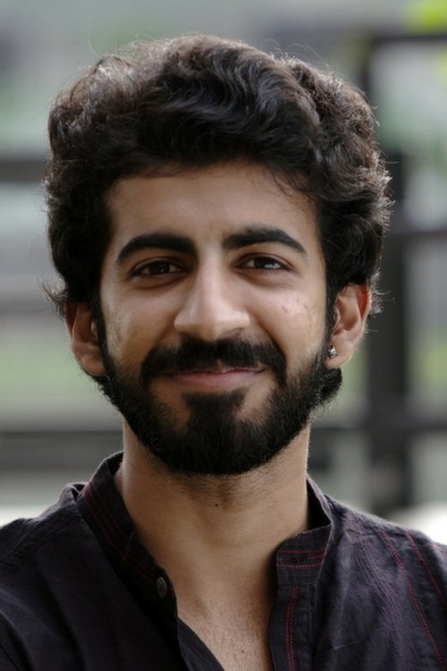 Roshan Mathew as Tomy, a Golden Retriever (Voice)