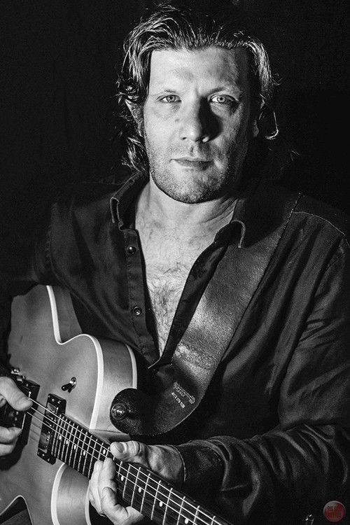 Kevin Oliver Jones as Musician in Theatre