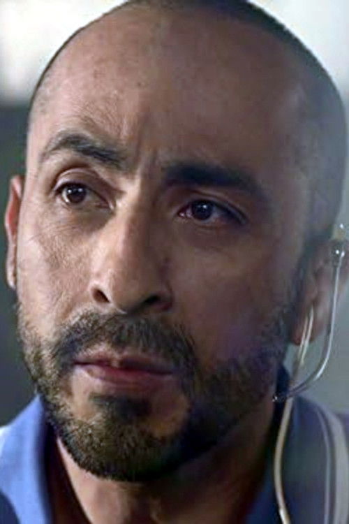 Rolando Alvarez Giacoman as Barber #1