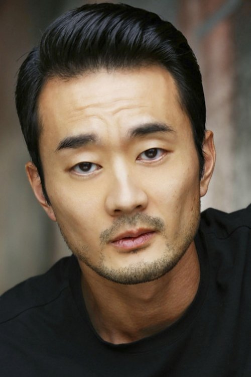 Jon Komp Shin as FBI Forensics Agent